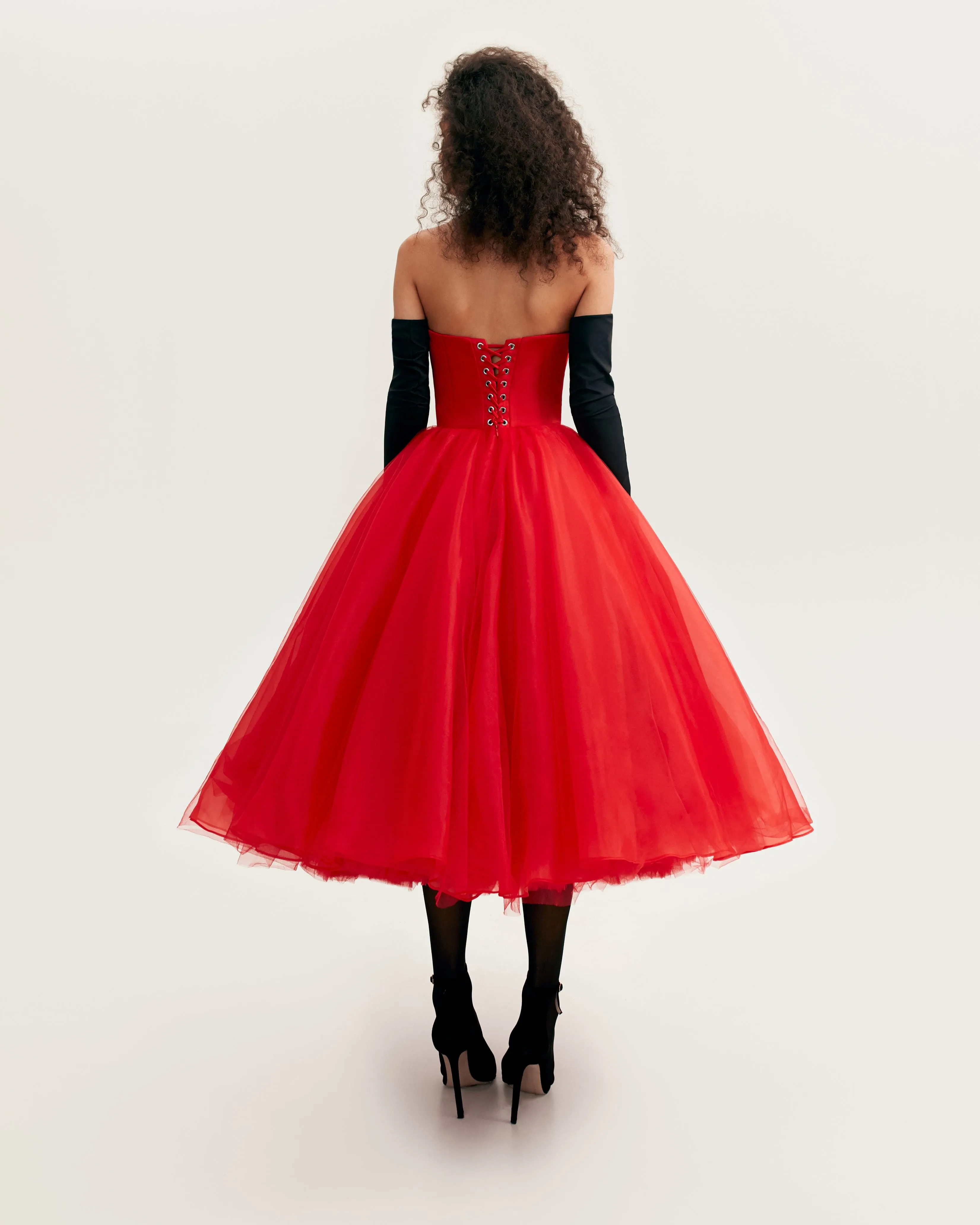 Dramatic red organza dress adorned with Milla's signature and black gloves, Xo Xo