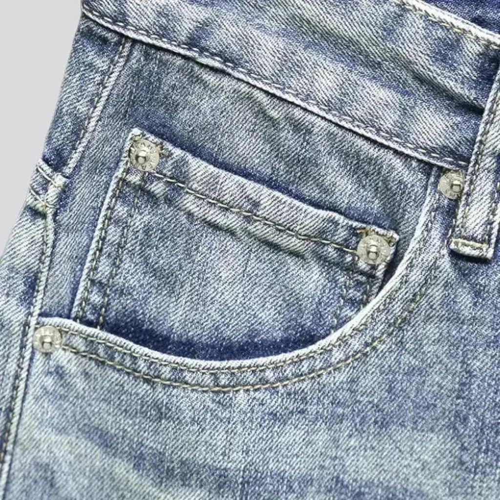 Medium-wash men's grunge jeans